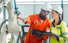 Supervisor and trainee in factory