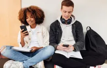 College students sitting in a hallway