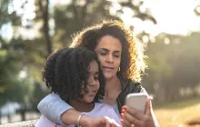 Mom and daughter on smartphone
