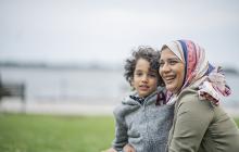 Woman in hijab with young son