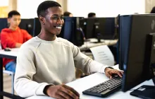 Young African American man working at desktop