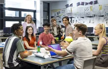 Happy high school students in a classroom