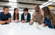 Teacher with apprentices as whiteboard table
