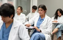 medical student taking notes in class
