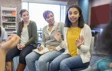 teen girl talking in a group meeting