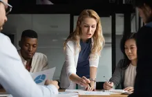 woman leading business meeting