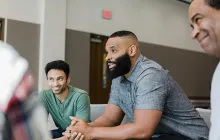 men talking in group therapy