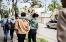 teens walking and talking in street