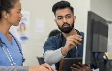 medical workers looking at a computer together