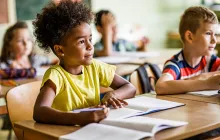 Young girl listening in the classroom