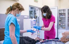 Nurses prepare patient for dialysis