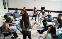 Teacher with circle of older students
