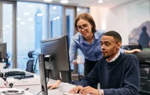 Coworkers at a computer