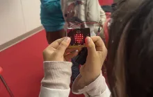 Girl holding microbit