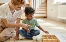 Montessori teacher and preschool student