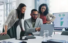Colleagues working together on a data project