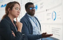 Thoughtful colleagues looking at data