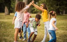Young children playing happily outside