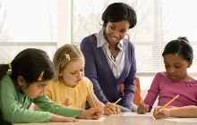 Teacher with young math students