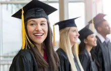 Smiling high school graduates