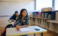 Student smiling in class.