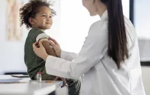 Little boy smiling after getting a shot