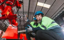 Factory workers inspecting machinery