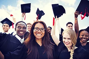 Graduates with caps in the air