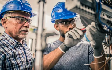 Electrician and apprentice