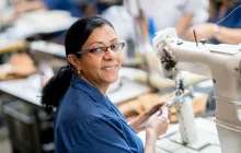 Latin American factory worker with sewing machine